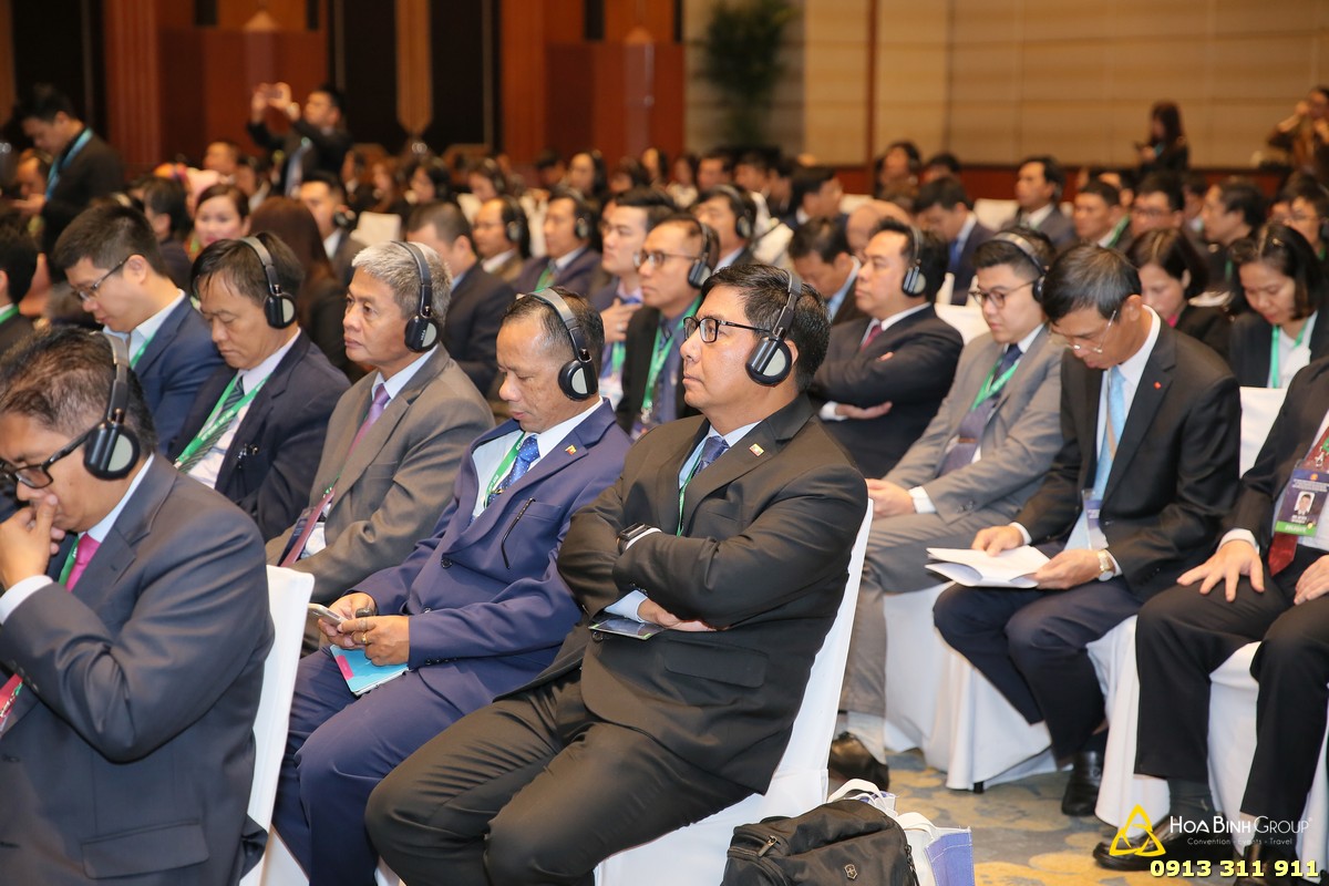 Delegates wearing headphones to be interpreted at the meeting