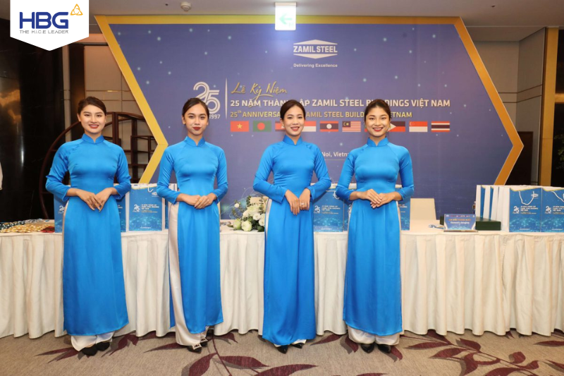 The reception team in Vietnamese ao dai welcomed guests attending the event